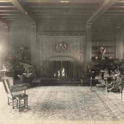 Byrne_013: Interior of Great Hall facing brick fireplace, photographed by August Patzig