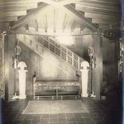 Byrne_024: Staircase with bench and rug, photographed by August Patzig