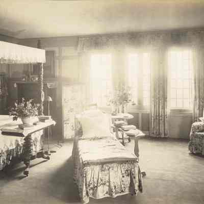 Byrne_027: Interior of bedroom facing windows, photographed by August Patzig