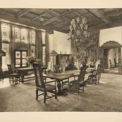 MEH image, located on table by door with tapestry behind it