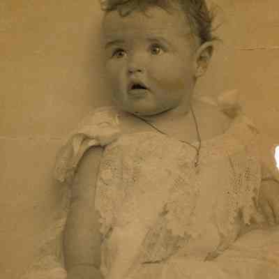 Coe_Natalie_002: Baby portrait of Natalie Coe with handwritten note from Mai Coe on backside