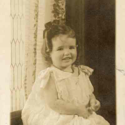 Coe_Natalie_007: Natalie Coe sitting on window ledge