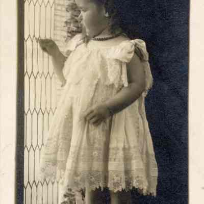 Coe_Natalie_008: Natalie Coe standing on window ledge