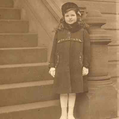 Coe_Natalie_012: Natalie Coe on brownstone steps, photographed by Paley's Studio