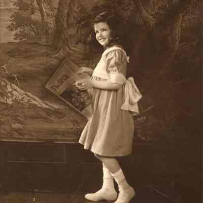 Coe_Natalie_024: Portrait of Natalie Coe holding magazine
