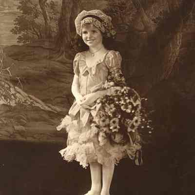Coe_Natalie_025: Portrait of Natalie Coe as a flower girl for a wedding, photographed by Underwood & Underwood