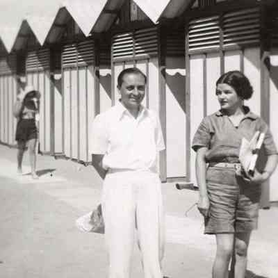 Coe_Natalie_037: Natalie Coe and Leonardo Vitetti in front of beach changing huts