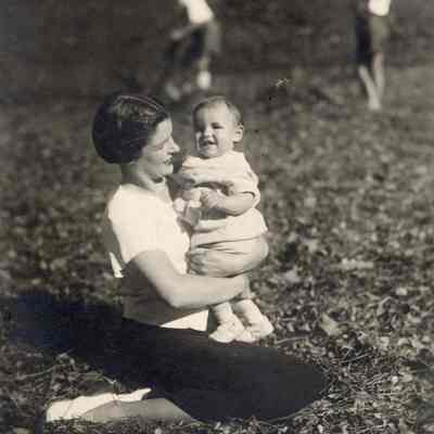 Coe_Natalie_046: Natalie Coe sitting and holding Ernesto Vitetti