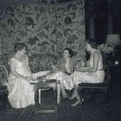 Natalie Coe (left) and guests circa 1950. Guest sitting on settee (image from archives)
