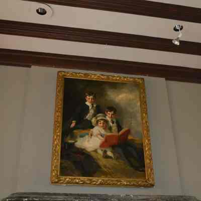 An American Impressionist style frame, for the print "Coe Children" in the Great Hall.