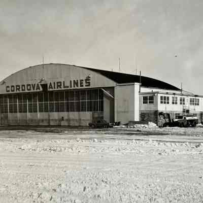 Cordova Hangar: Black and White Photograph of the Cordova Hangar.  The back side is blank.