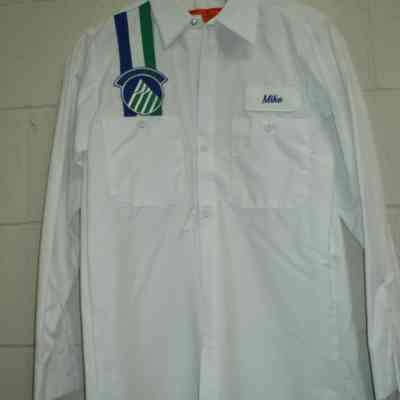 White mechanic shirt.  "Mike" name patch on left chest.  Two navy vertical stripes  with Alaska mountain logo on left chest.