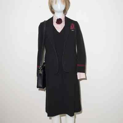 Black blazer with burgundy stripes on sleeves.