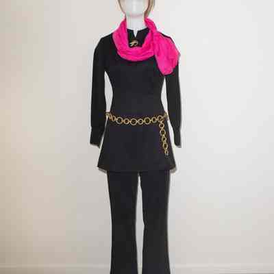 Black short tunic dress long sleeves, black long pants, tall black boots, gold chain belt, pin.
Could wear a purple, teal or raspberry scarf.