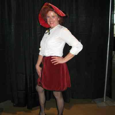 Short red skirt, 2 white blouses, black belt, small red hat.
Condition: Wrinkled shirt, skirt damaged in the front under last button.
Location: Museum of Flight