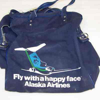 Alaska Airlines - Fly with a happy Face bag: Navy Blue with white lettering