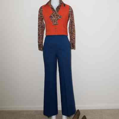 Orange vest, totem pole colored shirt/scarf, navy blue "straight legged" long pants.
Location: Museum of Flight.
