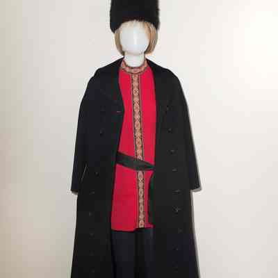 Red tunic dress with black sash, furry cossick hat, maxi black wool coat with velvet collar. 1/1970 to 1974
*Coat NOT included
