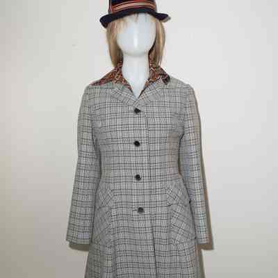 Grey, black, plaid long jacket, navy hat with striped band. Hat included.
Location: Museum of Flight