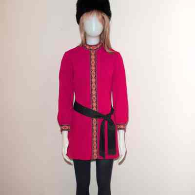 Red tunic dress with black sash, furry cossick hat. 1/1970 to 1974