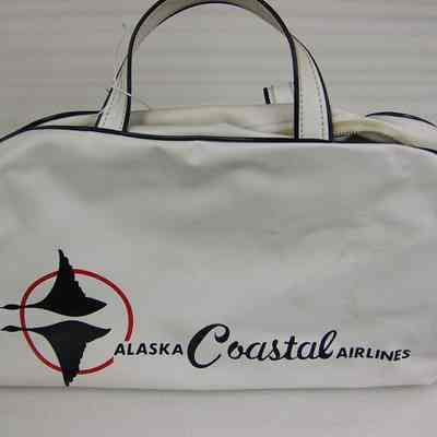 Alaska Coastal Airlines: White bag with blue lettering and trim