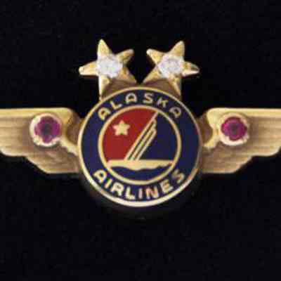 Alaska Airlines 20-year Service Pin - Gold Wings with two diamonds set in the stars, two rubies collet in wings