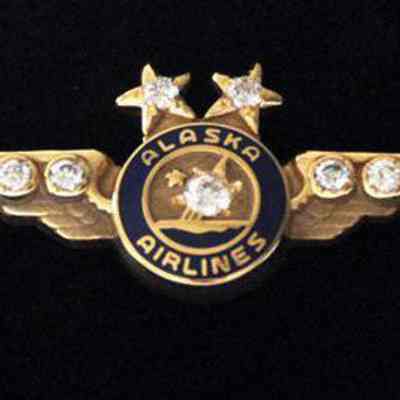 Alaska Airlines 45-year Service Pin - Gold Wings with two diamonds set in the stars, four diamonds collet in wings, one large diamond center
