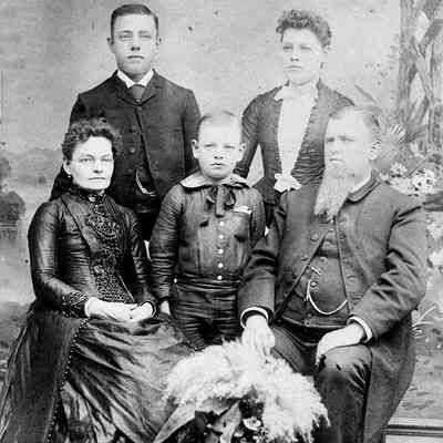 5 people,unidentified but likely a relative of the Henry or Wilson families.