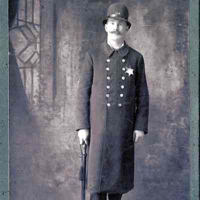 unidentified man in police uniform.