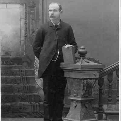 Unidentified man standing at podium