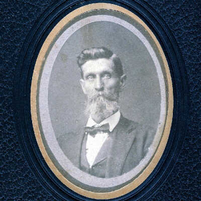 unidentified bearded older man in bow tie.