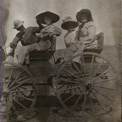 Harriet Miller (Olsen) in a wagon with Frank and Ella Fish.