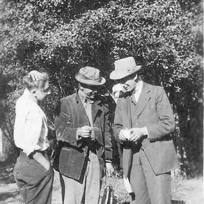 Frank Bunker and two other men Center man has a cache of fish.