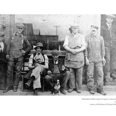 Men with Dog in Front of Shop