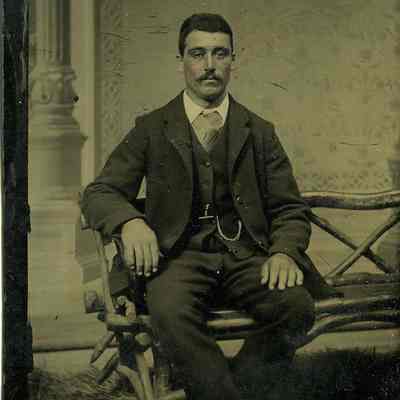 Unknown man seated on bench