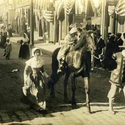 Child on horse being marched in 1914 Parade
