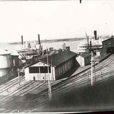 Town dock showing steam boats and railroad tracks, Stonington CT