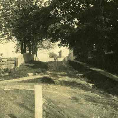 View of driveway(?) with construction at "The Hill"