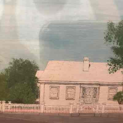 Unknown white house with fence