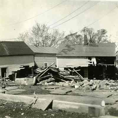 Damaged houses with lots of debris