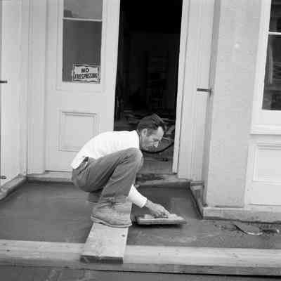 Mason working at 145 Water Street