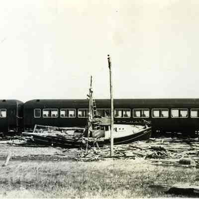 Fishing boat against derailed train