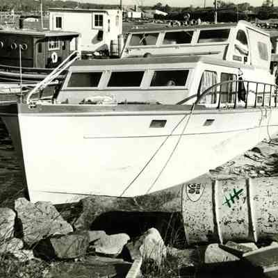 Motor boat against rocks
