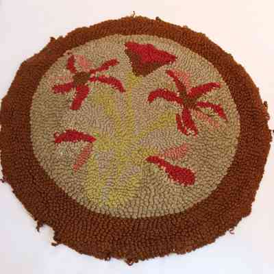 Red floral hooked rug