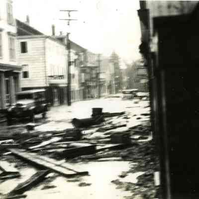 Looking south on Water Street with car and lots of debris