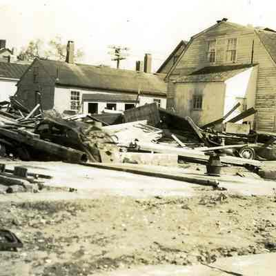 Damaged houses with debris