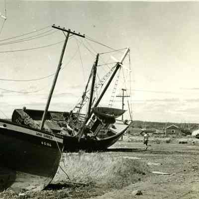 Fishing boats washed on shore