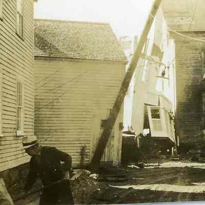 Men working on damaged houses