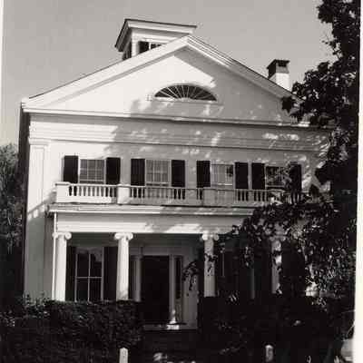 House with columns, cupola, half-circle window
