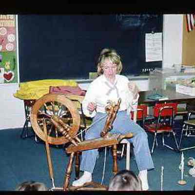 Spinning wool with tredle connected to pulley and spindle